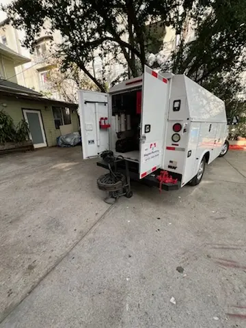 Magnet Plumbing service vehicle on-site for Grease Trap Cleaning in Siesta Village